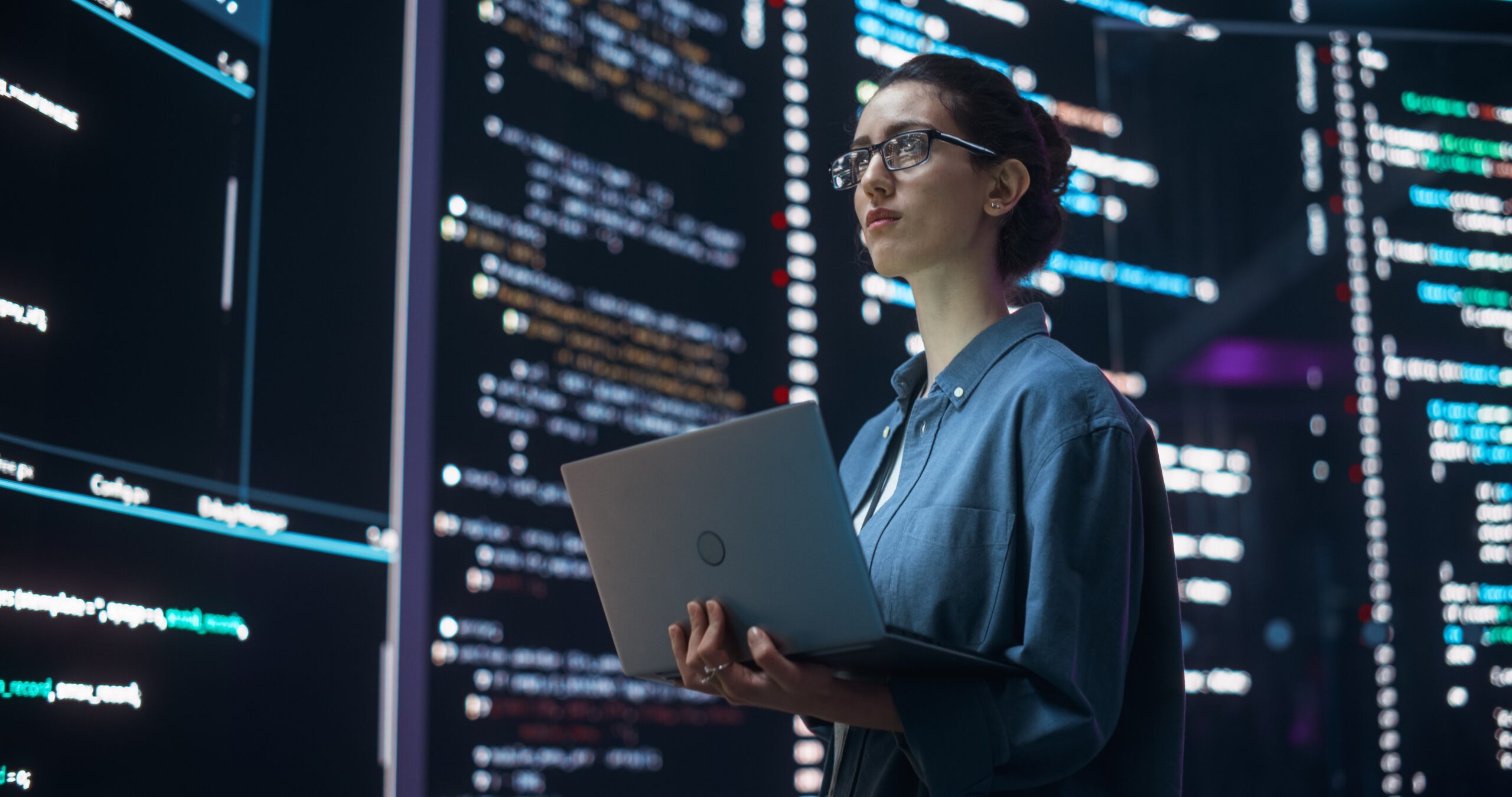 Portrait,of,woman,creating,a,software,and,coding,,surrounded,by